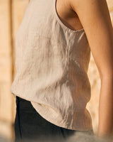 The Alba Linen Tank in khaki — close-up of curved side hem