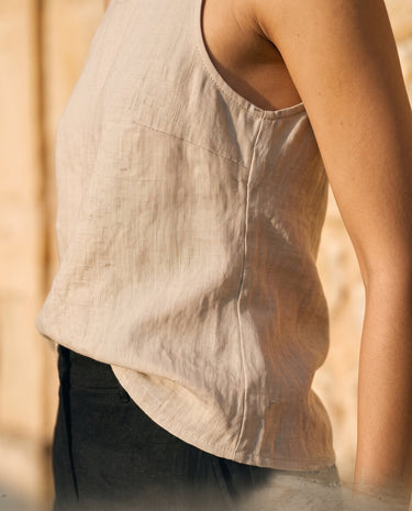The Alba Linen Tank in khaki — close-up of curved side hem