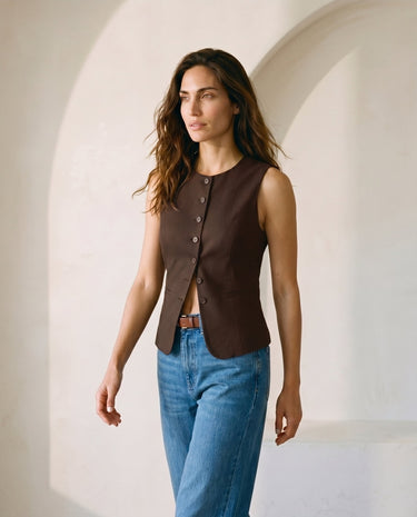 The Alicia vest in brown — front three-quarter view on model
