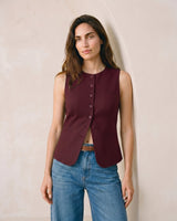 The Alicia vest in burgundy — front view on model