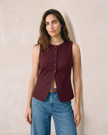 The Alicia vest in burgundy — front view on model