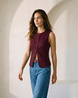 The Alicia vest in burgundy — front three-quarter view on model