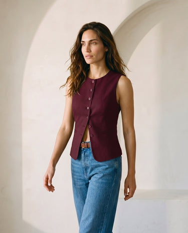 The Alicia vest in burgundy — front three-quarter view on model