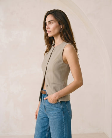 The Alicia vest in khaki — side profile view on model