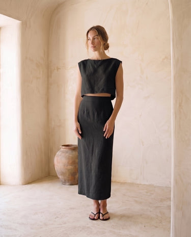 The Alora Linen Blend Set in black — linen-blend top and maxi skirt, front view on model