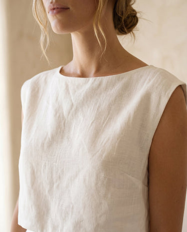 The Alora Linen Blend Set in white — close-up of sleeveless boat-neck top