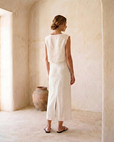 The Alora Linen Blend Set in white — linen-blend top and maxi skirt, back view on model