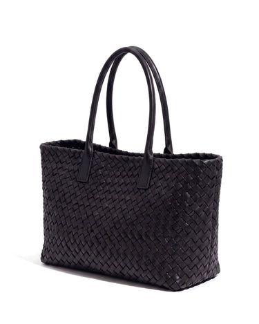 The Amalfi Woven Tote in black, three-quarter studio view on a pure white background