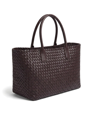The Amalfi Woven Tote in brown, rear three-quarter view showing the matching woven back panel