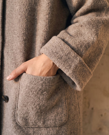 The Aria Scarf Cape Coat in khaki — close-up of patch pocket and brushed texture