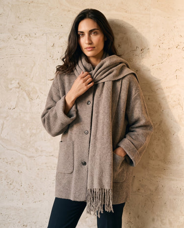 The Aria Scarf Cape Coat in khaki — coat with draped scarf cape, front view on model