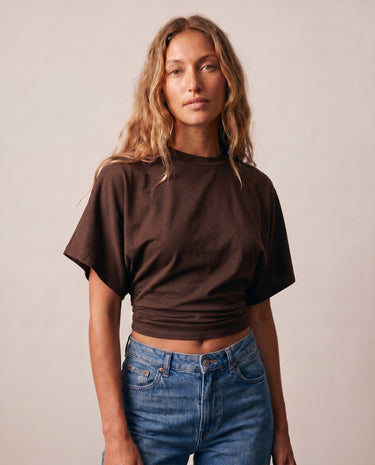 Front view of the brown ruched-side tee showing the cropped hem – Moriel Heritage