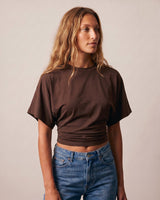 Three-quarter view of the brown ruched-side tee – Moriel Heritage