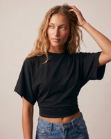 Model with hand in hair wearing the black ruched-side tee – Moriel Heritage
