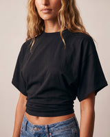 Close front view of the black ruched-side tee and its dolman sleeves – Moriel Heritage