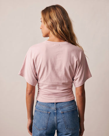 Back view of the pink ruched-side tee showing the dolman sleeves – Moriel Heritage