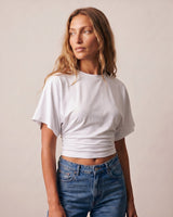 Front view of the white ruched-side tee worn with blue jeans – Moriel Heritage