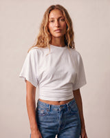 Front view of the white ruched-side tee showing the cropped hem – Moriel Heritage