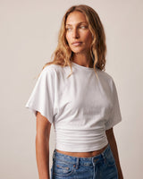 Three-quarter view of the white ruched-side tee – Moriel Heritage