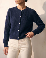 The Arlo Cardigan in navy — front three-quarter view on model