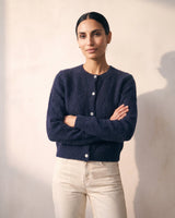 The Arlo Cardigan in navy — front view on model