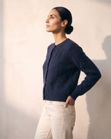 The Arlo Cardigan in navy — side view on model