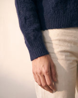 The Arlo Cardigan in navy — close-up of the ribbed cuff and knit texture