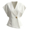 The Asymmetrical Vest in white — textured sleeveless vest with V wrap front and single button, product flat-lay