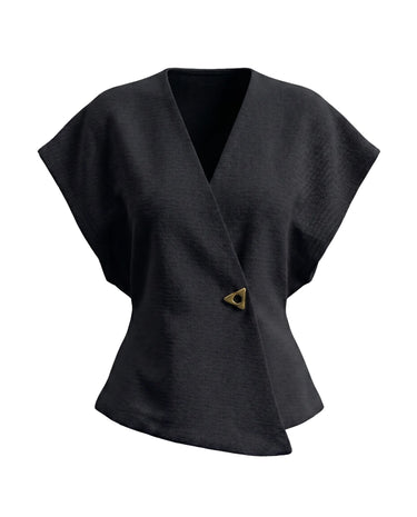 The Asymmetrical Vest in black — textured sleeveless vest with V wrap front and single button, product flat-lay
