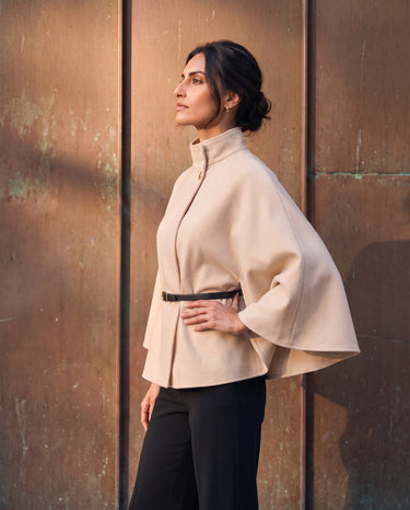 The Aurelia Shawl in beige — side view on model