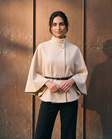 The Aurelia Shawl in beige — front view on model