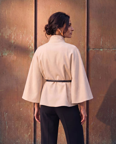 The Aurelia Shawl in beige — back view on model