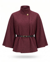 The Aurelia Shawl in burgundy — belted cape with stand collar and gold button, product flat-lay