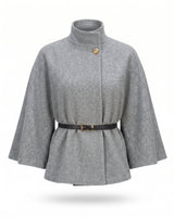 The Aurelia Shawl in gray — belted cape with stand collar and gold button, product flat-lay