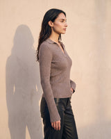 The Avery Knitted Sweater in brown — front three-quarter view on model