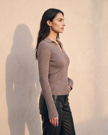 The Avery Knitted Sweater in brown — front three-quarter view on model