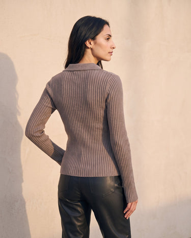 The Avery Knitted Sweater in brown — back three-quarter view on model