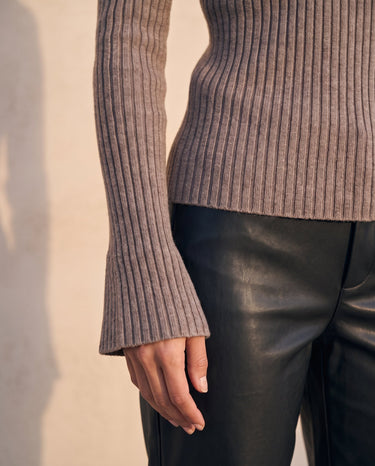 The Avery Knitted Sweater in brown — close-up of the ribbed knit and flared cuff