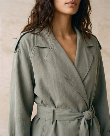 The Avielle Belted Trench in green — close-up of oversized lapel collar and neckline