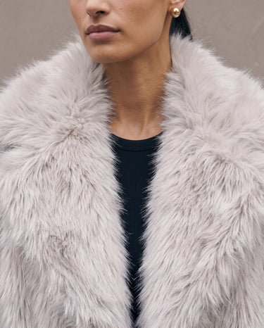 Close-up of the Ballerina coat's wide faux fur collar and long-pile texture in light gray