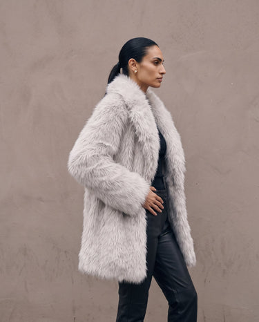 Side profile of the light gray Ballerina Faux Fur Coat showing the relaxed silhouette
