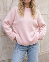 The Blush Sweater in pink — front view on model