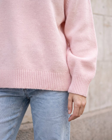 The Blush Sweater in pink — close-up of the ribbed cuff and hem