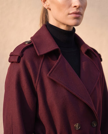 The Burgundy Celine Coat in burgundy — close-up of the notch lapel and double-breasted buttons