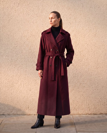 The Burgundy Celine Coat in burgundy — side view on model