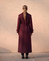 The Burgundy Celine Coat in burgundy — back view on model