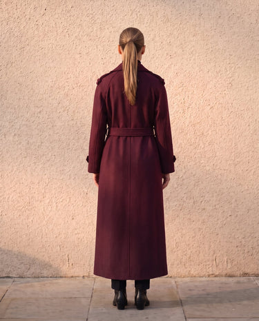 The Burgundy Celine Coat in burgundy — back view on model