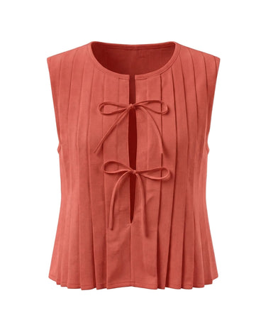 The Cala Cotton Linen Tie Top in peach — sleeveless pleated crew-neck top with front bow ties, product flat-lay