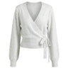 The Calira Wrap Knit in gray — knit wrap top with surplice V neckline and side tie, product flat-lay