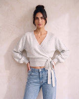 The Calira Wrap Knit in gray — knit wrap top, front view on model